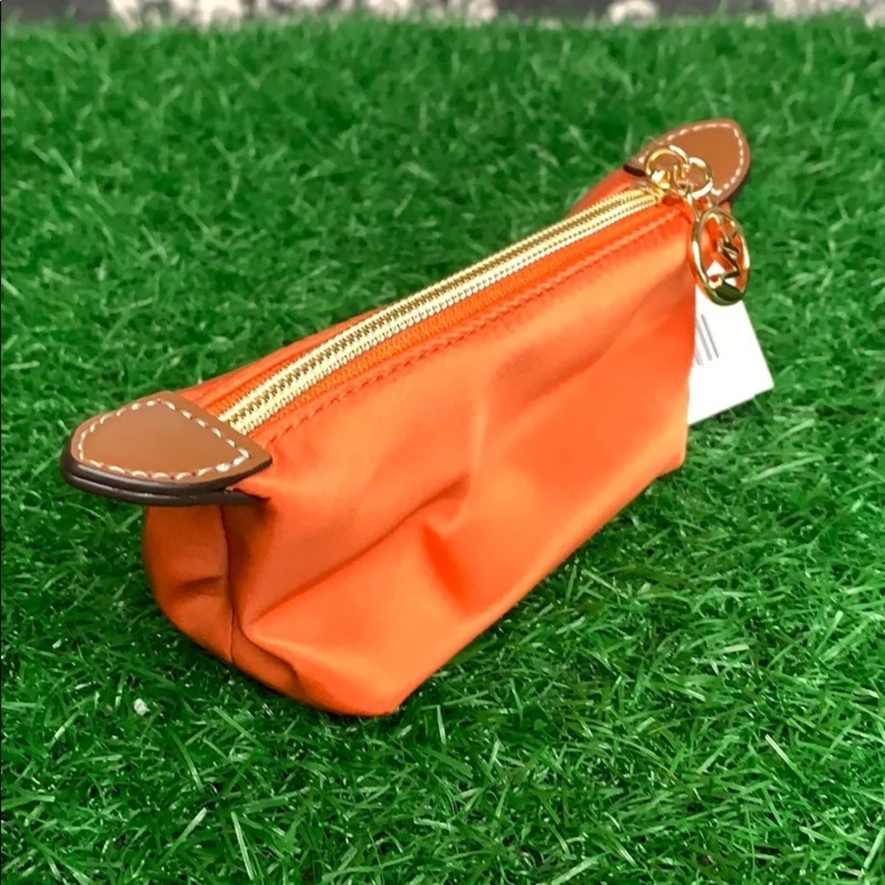 MICHAEL KORS TRAVEL XS POUCH TANGERINE - Picture 7 of 16